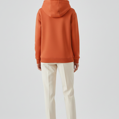 Women’s hoodie pullover by THE WHITMORE FAMILY with sherpa lining and ribbed cuffs, shown in a cozy, casual style.