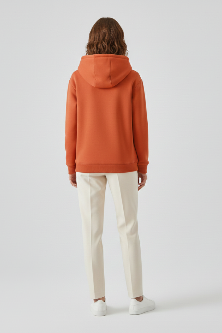 Women’s hoodie pullover by THE WHITMORE FAMILY with sherpa lining and ribbed cuffs, shown in a cozy, casual style.