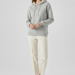 Women’s pullover hoodie by THE WHITMORE FAMILY with sherpa lining and ribbed cuffs, cozy and warm for winter wear.