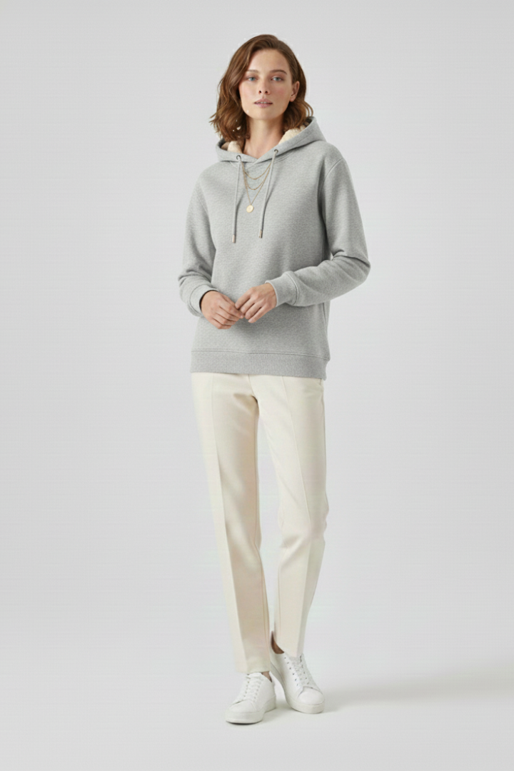 Women’s pullover hoodie by THE WHITMORE FAMILY with sherpa lining and ribbed cuffs, cozy and warm for winter wear.