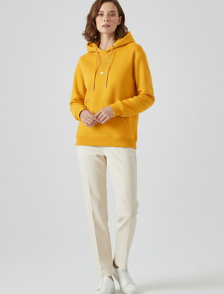 Women’s hoodie pullover by THE WHITMORE FAMILY featuring sherpa lining and ribbed cuffs, displayed on a model.