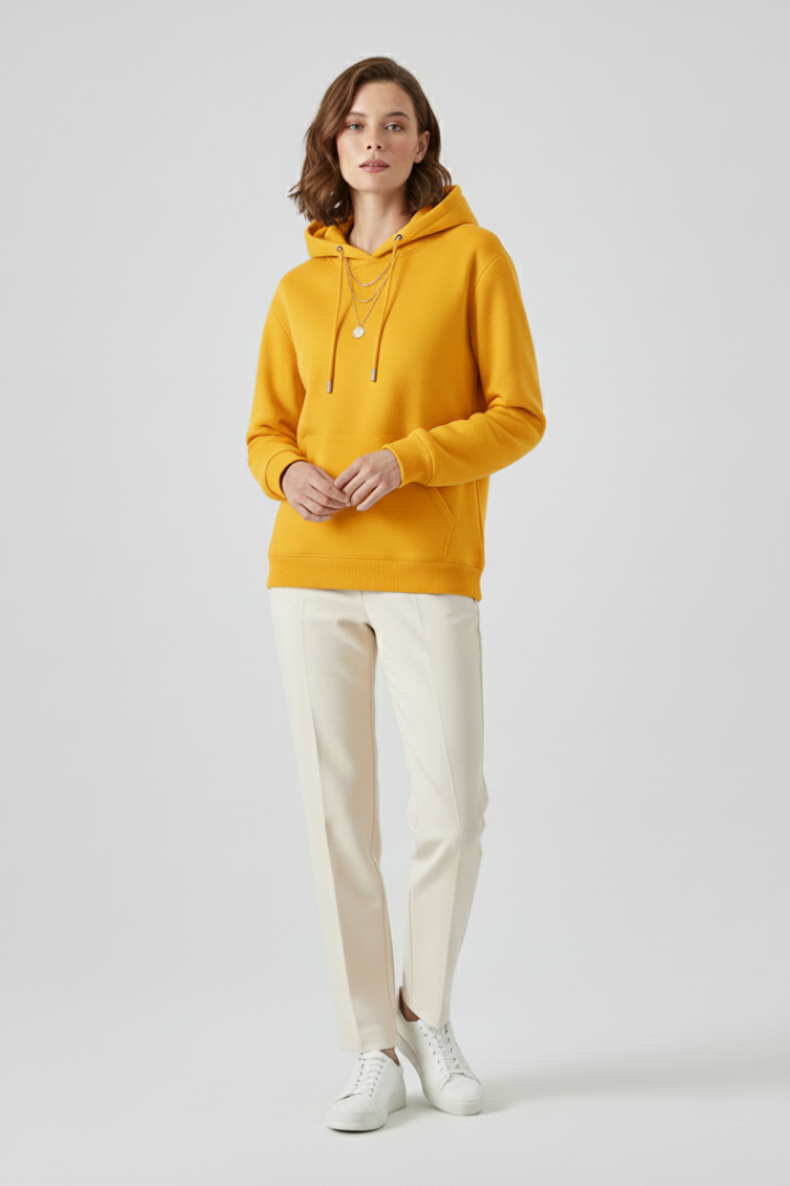 Women’s hoodie pullover by THE WHITMORE FAMILY featuring sherpa lining and ribbed cuffs, displayed on a model.