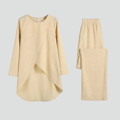 Women’s shirt and trousers set with long sleeves and straight-leg design by THE WHITMORE FAMILY, shown on a model.