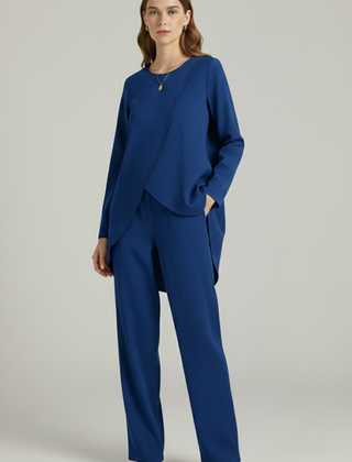 Women's shirt and trousers set by THE WHITMORE FAMILY featuring long sleeves and straight-leg design, perfect for casual wear.