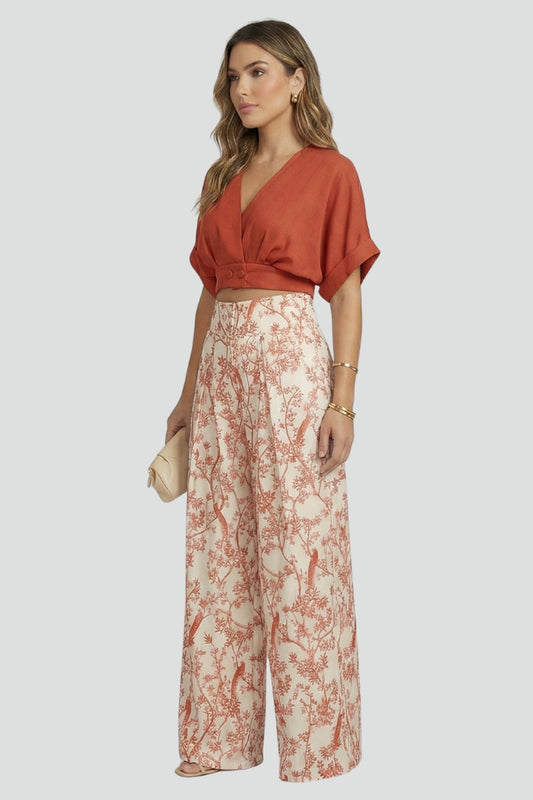 Women’s black two-piece set with V-neck top and wide-leg trousers from THE WHITMORE FAMILY, casual stylish women's outfit.