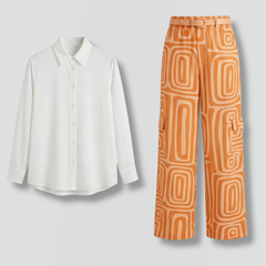 Women’s shirt and trousers set by THE WHITMORE FAMILY featuring button closure and straight-leg pants, shown on a model.