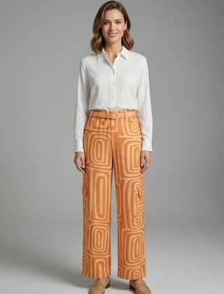 Women’s shirt and trousers set by THE WHITMORE FAMILY, featuring button closure and straight-leg design, casual and stylish.