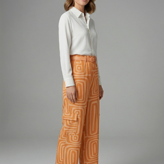 Women’s shirt and trousers set by THE WHITMORE FAMILY featuring a button closure and straight-leg design, stylish and comfortable.