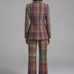 Women’s suit set featuring a double-breasted blazer and wide-leg trousers by THE WHITMORE FAMILY, shown in a stylish, tailored fit.