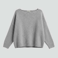 Women’s sweater by THE WHITMORE FAMILY featuring a wide neckline and brushed knit surface, shown on a model.