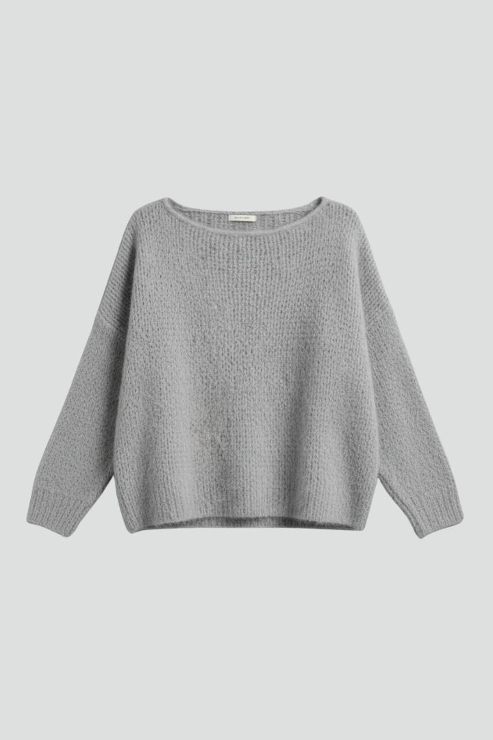 Women’s sweater by THE WHITMORE FAMILY featuring a wide neckline and brushed knit surface, shown on a model.