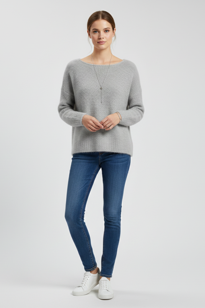 Women’s sweater by THE WHITMORE FAMILY featuring a wide neckline and soft brushed knit surface, shown in a cozy fit.