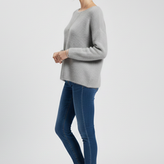 Women’s sweater by THE WHITMORE FAMILY featuring a wide neckline and soft brushed knit surface, styled with long sleeves.