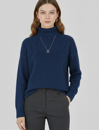 Women’s sweater with turtleneck and textured cable pattern by THE WHITMORE FAMILY, showing a cozy knit design in neutral tones.