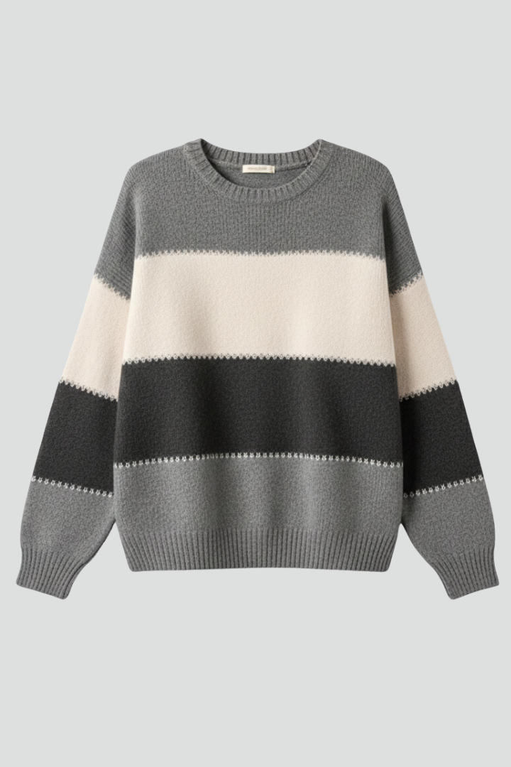 Women’s striped knit sweater with round neck and ribbed trim, from THE WHITMORE FAMILY, shown on a model.