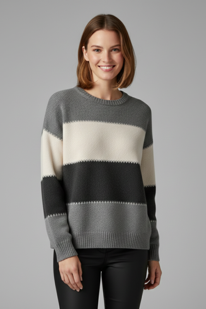 Women’s striped knit sweater with round neck and ribbed trim, from THE WHITMORE FAMILY, shown on a model.