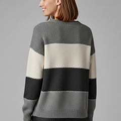 Women's striped knit sweater by THE WHITMORE FAMILY featuring a round neck and ribbed trim, cozy and stylish for casual wear.