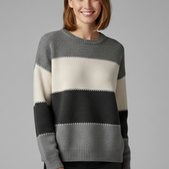 Women’s striped knit sweater with round neck and ribbed trim from THE WHITMORE FAMILY, styled with long sleeves and soft fabric.