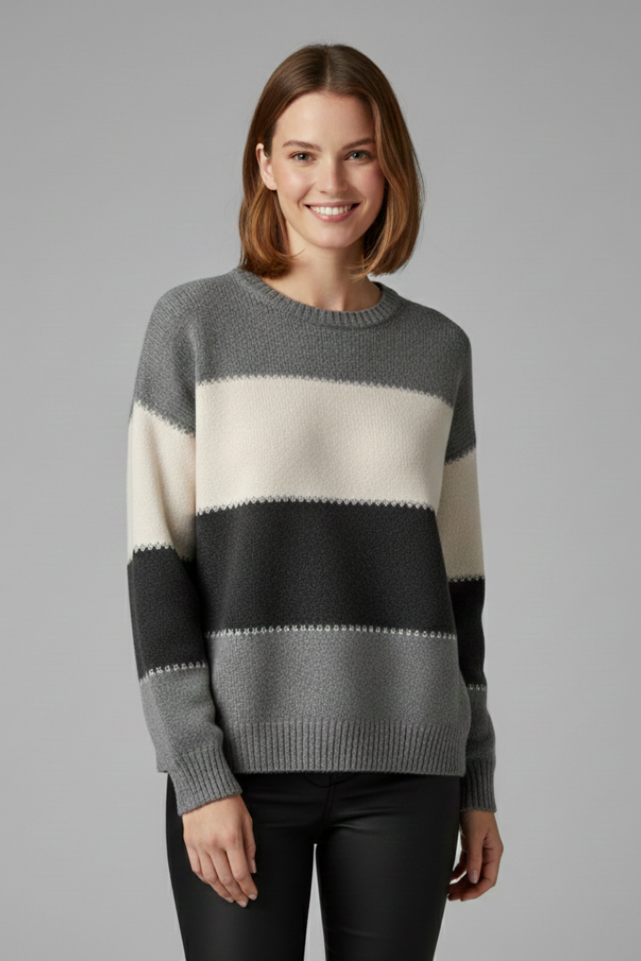 Women’s striped knit sweater with round neck and ribbed trim from THE WHITMORE FAMILY, styled with long sleeves and soft fabric.
