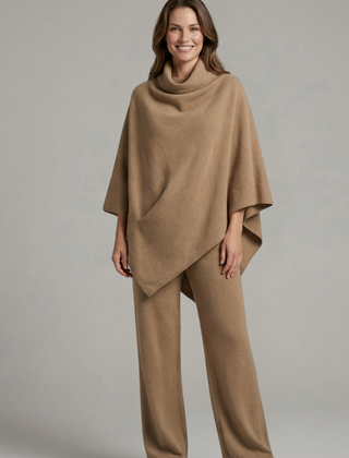 Women’s black top and trousers set by THE WHITMORE FAMILY featuring a high neck and wide sleeves, stylish and comfortable ensemble.