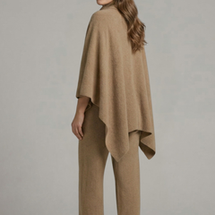Women’s black top and trousers set by THE WHITMORE FAMILY with a high neck and wide sleeves, stylish and comfortable outfit.