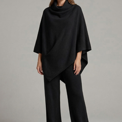 Women’s black top and trousers set by THE WHITMORE FAMILY, featuring a high neck and wide sleeves, stylish and comfortable.
