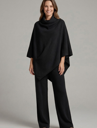 Women’s black top and trousers set by THE WHITMORE FAMILY, featuring a high neck and wide sleeves, stylish and comfortable.