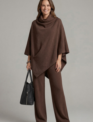 Women’s black top and trousers set with high neck and wide sleeves by THE WHITMORE FAMILY, stylish and comfortable for casual wear.