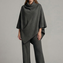 Women’s black top and trousers set with high neck and wide sleeves by THE WHITMORE FAMILY, stylish and comfortable outfit.