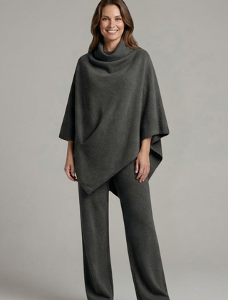 Women’s black top and trousers set with high neck and wide sleeves by THE WHITMORE FAMILY, stylish and comfortable outfit.