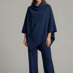 Women’s black top and trousers set by THE WHITMORE FAMILY featuring a high neck and wide sleeves, casual and stylish ensemble.