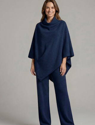 Women’s black top and trousers set by THE WHITMORE FAMILY featuring a high neck and wide sleeves, casual and stylish ensemble.