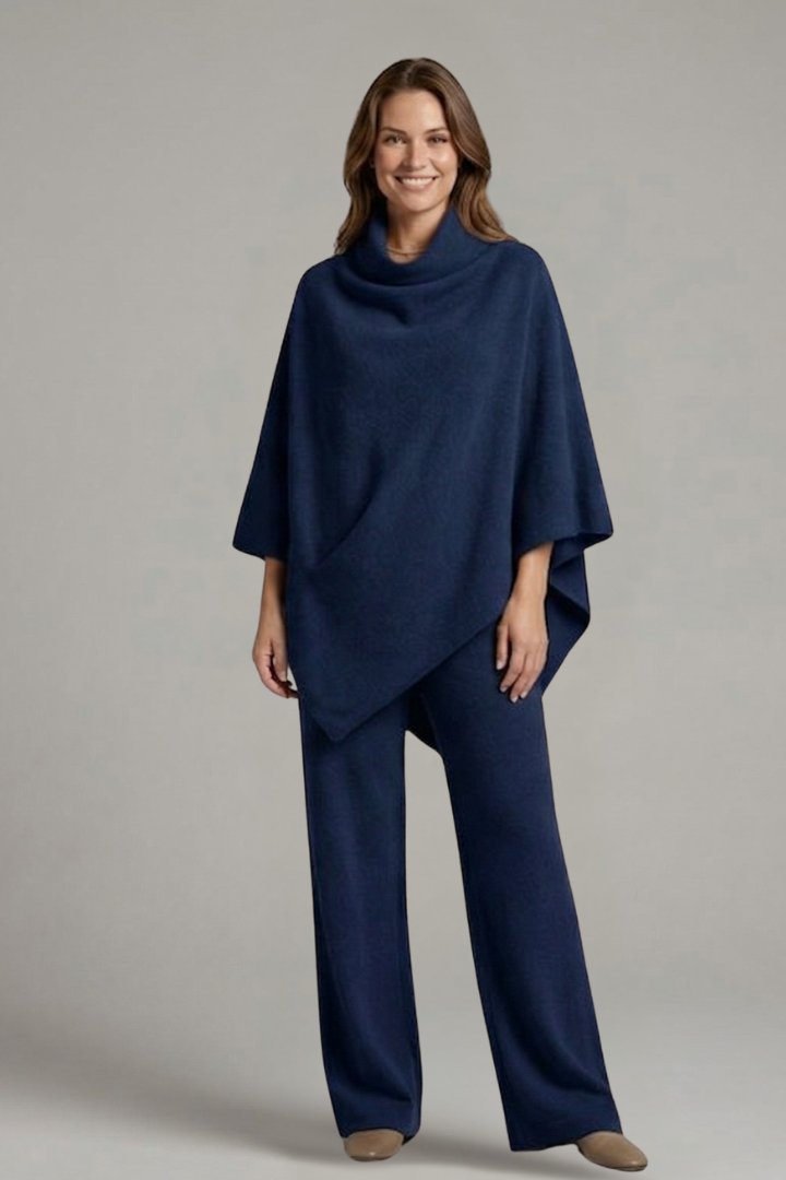 Women’s black top and trousers set by THE WHITMORE FAMILY featuring a high neck and wide sleeves, casual and stylish ensemble.