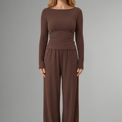 Women’s top and trousers set with relaxed fit and long sleeves, by THE WHITMORE FAMILY, shown in a casual, comfortable style.