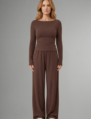 Women’s top and trousers set with relaxed fit and long sleeves, by THE WHITMORE FAMILY, shown in a casual, comfortable style.