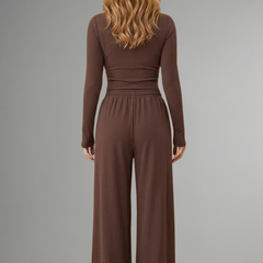 Women’s relaxed fit top and trousers set with long sleeves by THE WHITMORE FAMILY, showcasing comfortable casual wear.