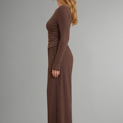 Women’s relaxed fit top and trousers set with long sleeves by THE WHITMORE FAMILY, shown in a stylish, casual outfit.