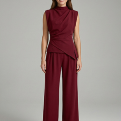 Women’s top and trousers set with round neck and straight legs from THE WHITMORE FAMILY, shown in a stylish, coordinated outfit.
