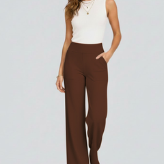 Women’s wide-leg trousers with high waist and side pockets from THE WHITMORE FAMILY, shown in a stylish, relaxed fit.