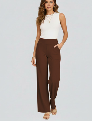 Women’s wide-leg trousers with high waist and side pockets from THE WHITMORE FAMILY, shown in a stylish, relaxed fit.