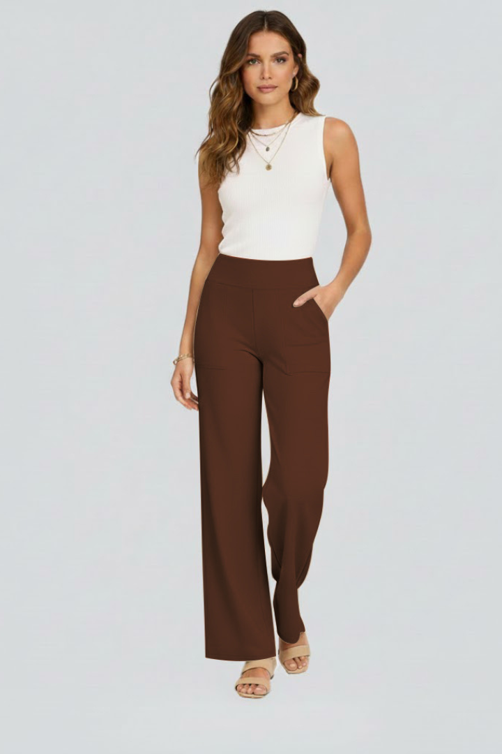Women’s wide-leg trousers with high waist and side pockets from THE WHITMORE FAMILY, shown in a stylish, relaxed fit.