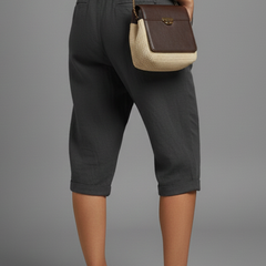 Beige women's knee-length trousers with high-waisted fit and straight legs from THE WHITMORE FAMILY.