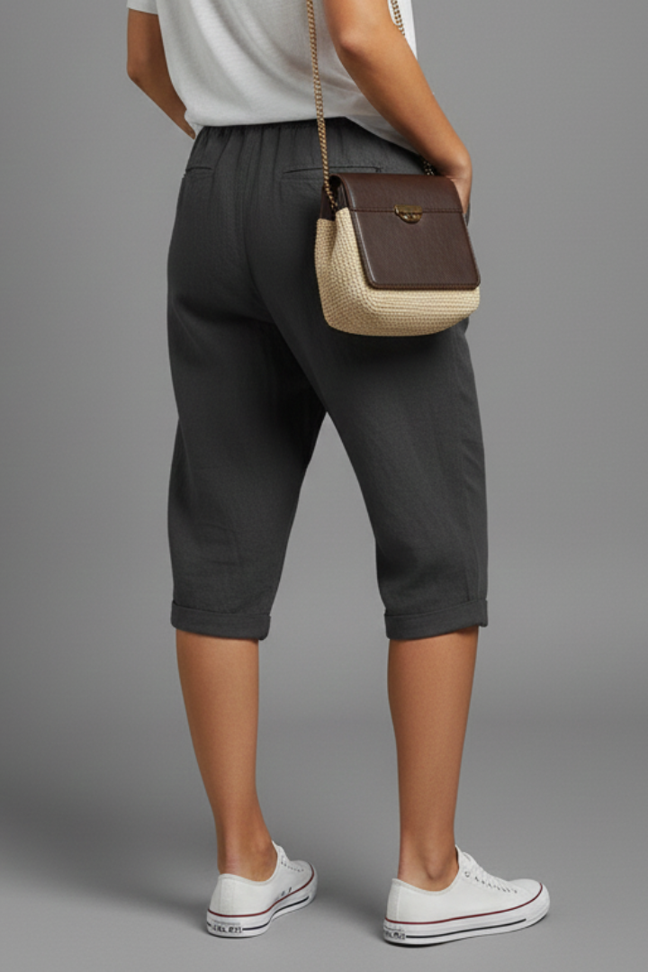 Beige women's knee-length trousers with high-waisted fit and straight legs from THE WHITMORE FAMILY.