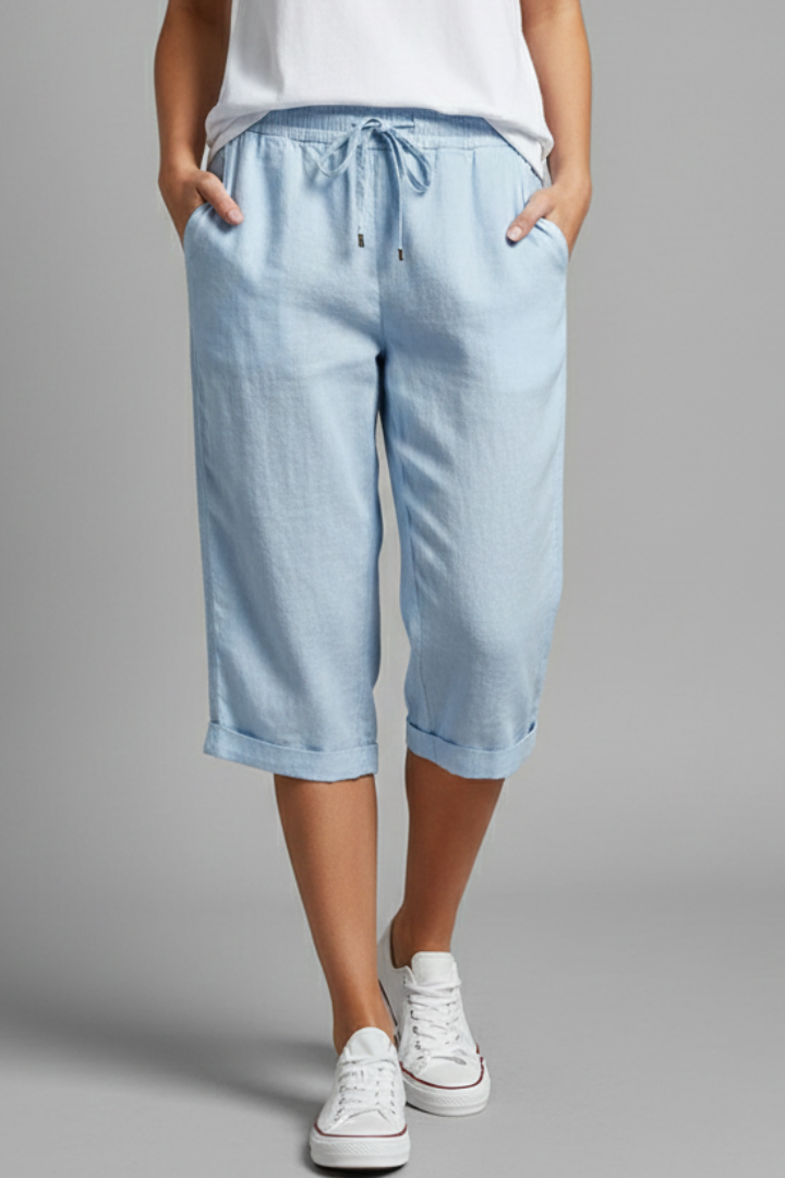 Beige women's knee-length trousers with high-waisted fit and straight legs from THE WHITMORE FAMILY.