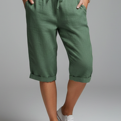 Women’s knee-length trousers with high-waisted fit and straight legs, by THE WHITMORE FAMILY, shown in a stylish and comfortable design.