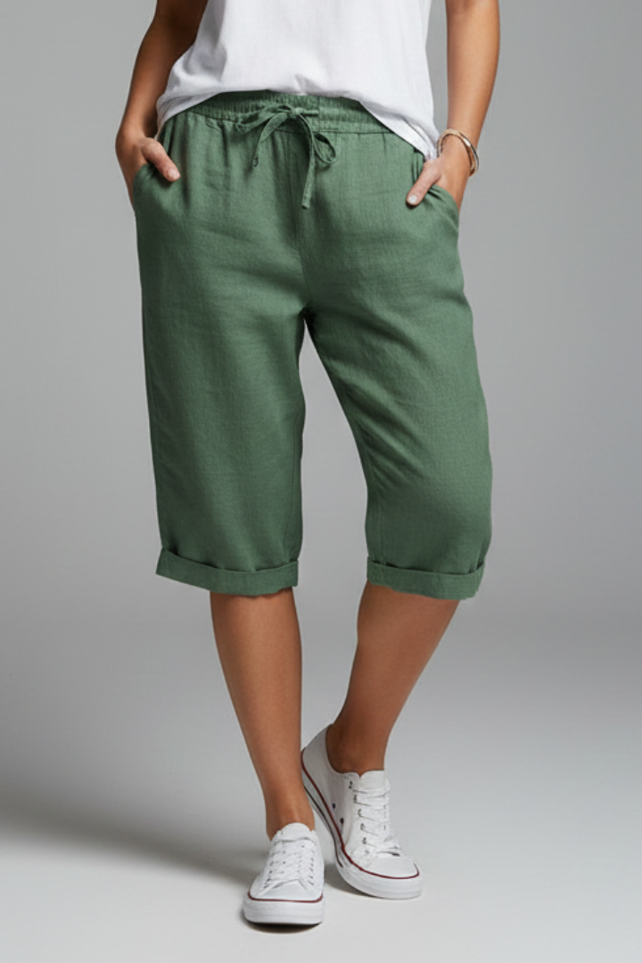 Women’s knee-length trousers with high-waisted fit and straight legs, by THE WHITMORE FAMILY, shown in a stylish and comfortable design.