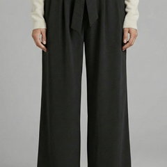 Beige women's palazzo trousers with tie waist and relaxed fit, stylish women's trousers by THE WHITMORE FAMILY.