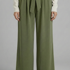 Beige women’s palazzo trousers with tie waist from THE WHITMORE FAMILY, flowing wide-leg style, perfect for casual or dressy looks.