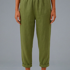 Beige women’s trousers with elastic waistband and side pockets by THE WHITMORE FAMILY, shown on a model.