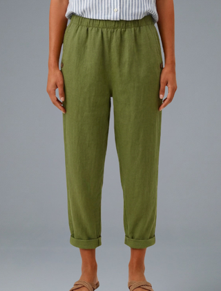 Beige women’s trousers with elastic waistband and side pockets by THE WHITMORE FAMILY, shown on a model.
